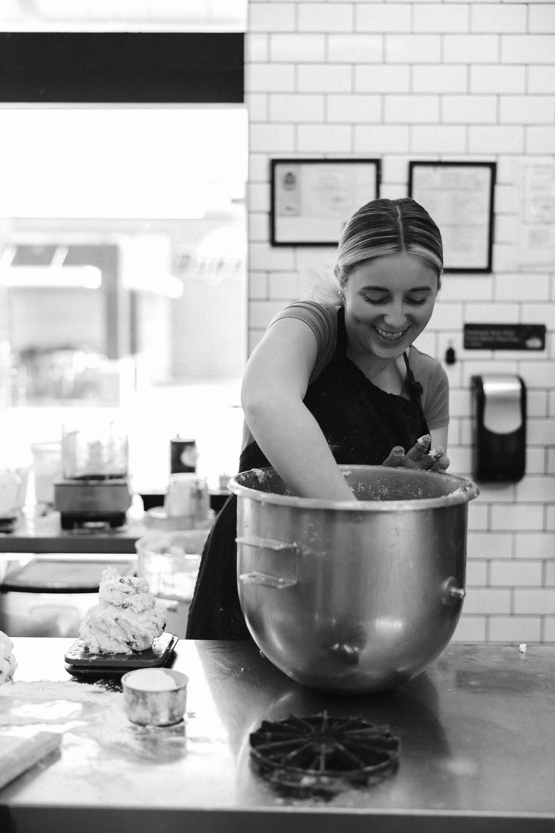 Mar 2026 baker mixing dough black and white