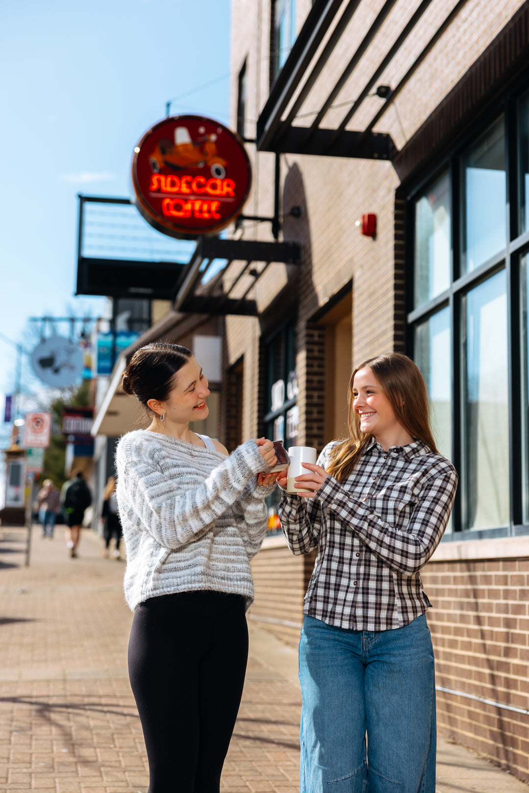 Mar 2026 customers cheers under Sidecar sign